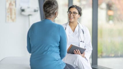 A female doctor discussing with a patient the VAT implications for cosmetic and medical procedures